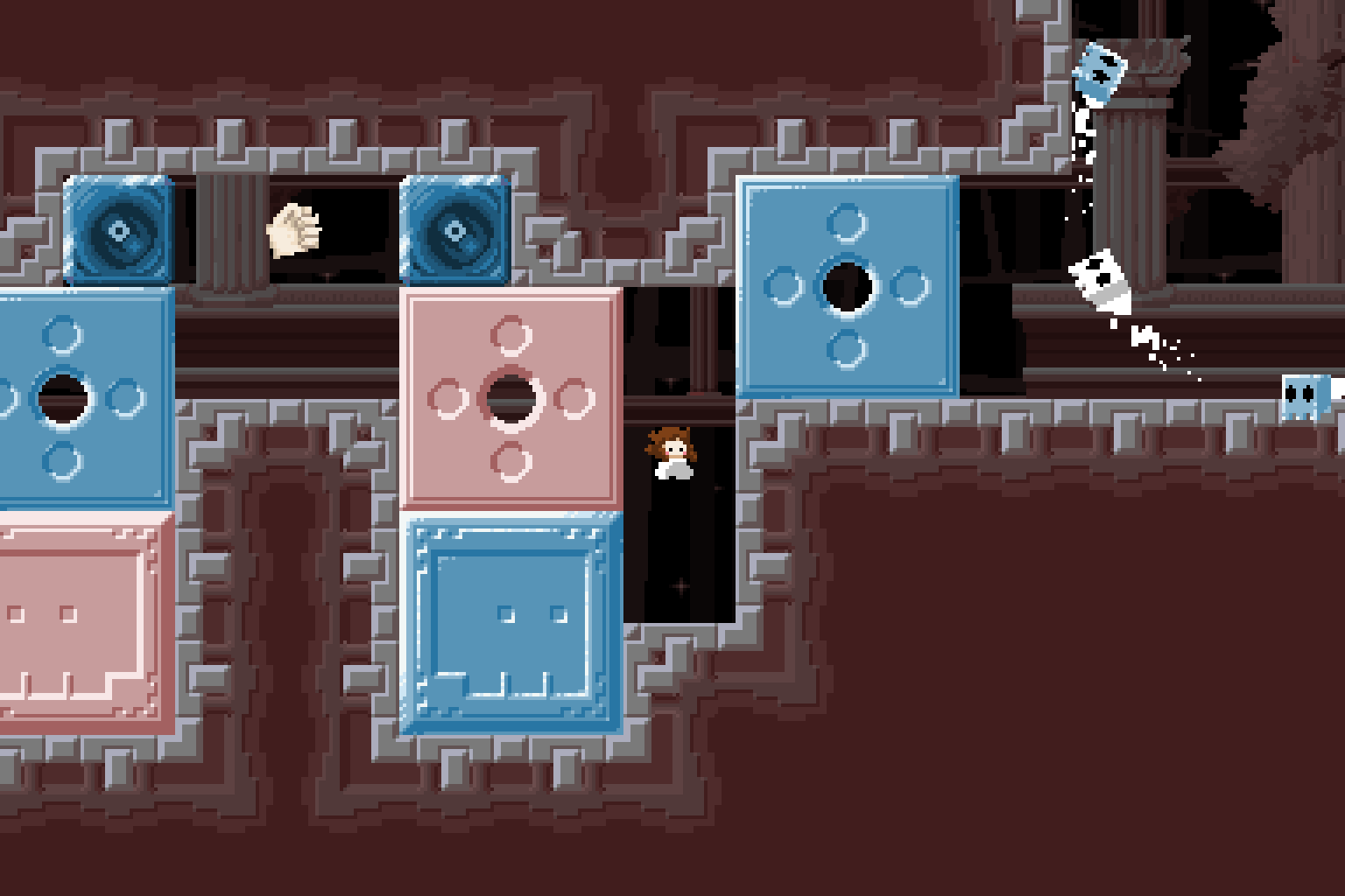 screenshot: Vivi is inside some mysterious catacombs. Pink and blue blocks are decorated with holes and skulls, while off to the right of the screen a series of floating skulls move in a circle.